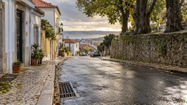 A Portuguese residential street with clear stormwater drains.