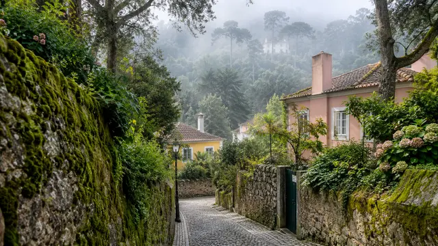 Sintra-inspired forest-edge neighbourhood with mossy stone walls.