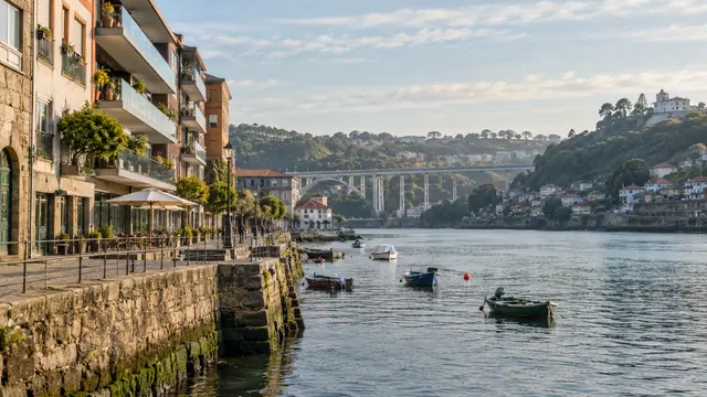 Greater Porto-inspired riverbank suburb with modern apartment balconies.